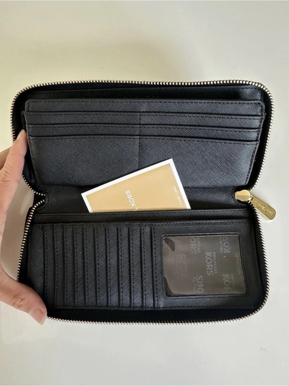 Michael Kors Black Pebbled Leather Zip Wallet with Gold Tone Zipper Pull